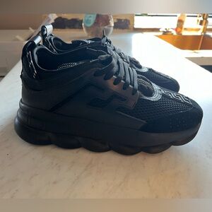 Versace chain reactions.